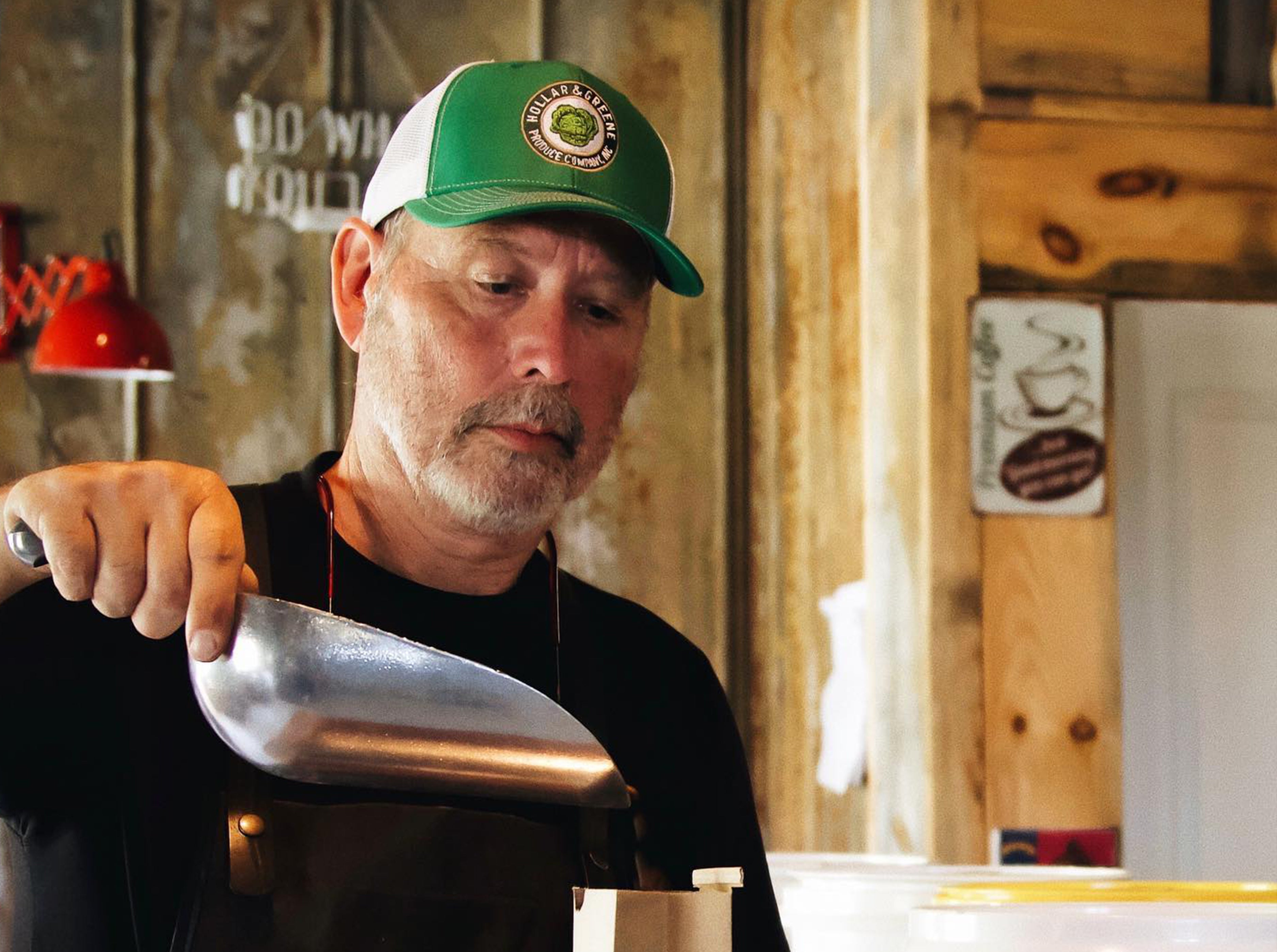 Don Cox at Bald Guy Brew Roastery in Boone Weighing Coffee Beans