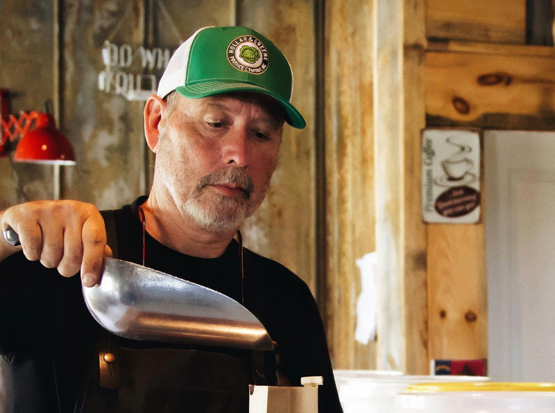 Don Cox at Bald Guy Brew Roastery in Boone Weighing Coffee Beans